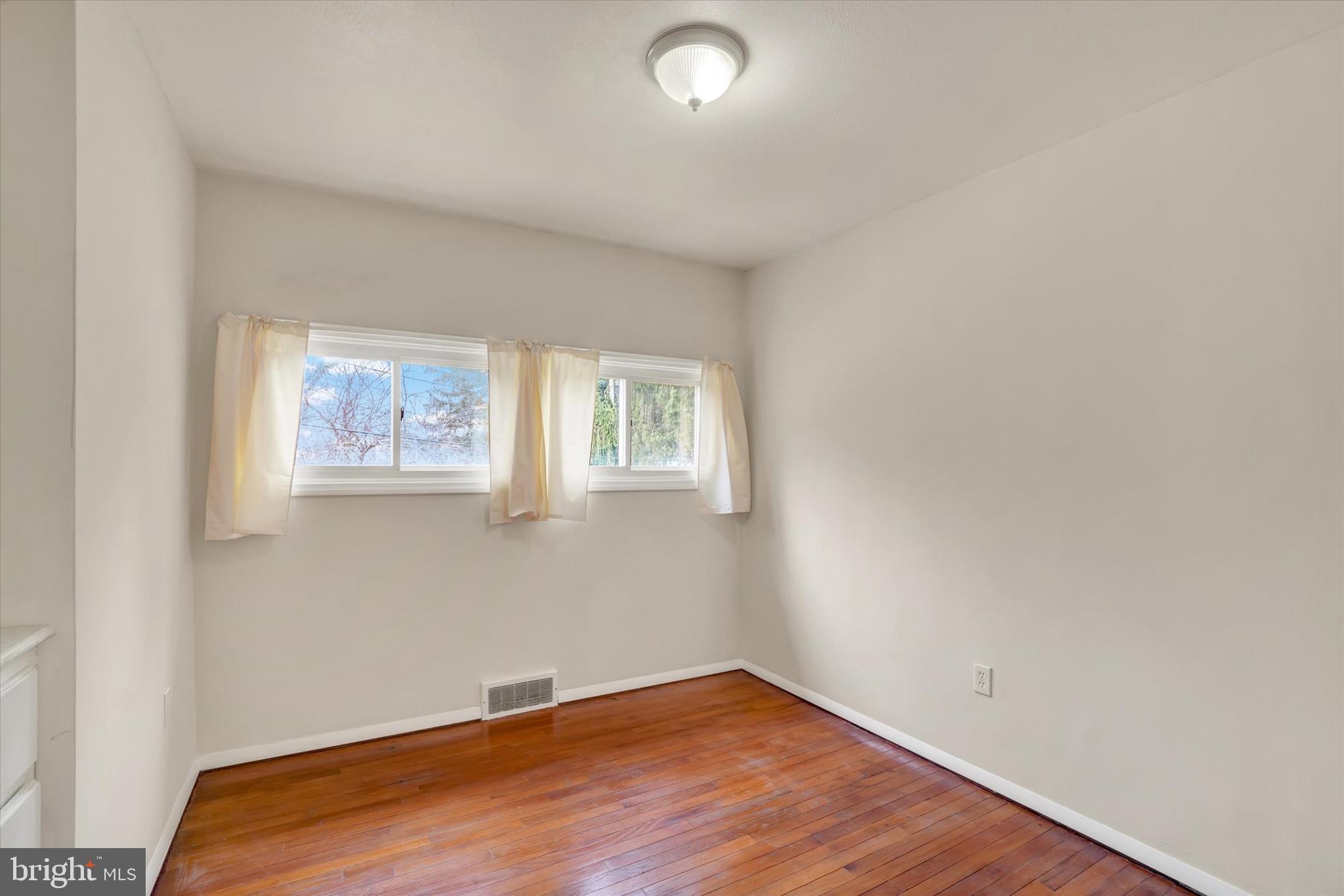 310 Herman Street York, PA 17404 - Photo 16 of 31 Bright natural lighting & hardwood in 2nd Bedroom