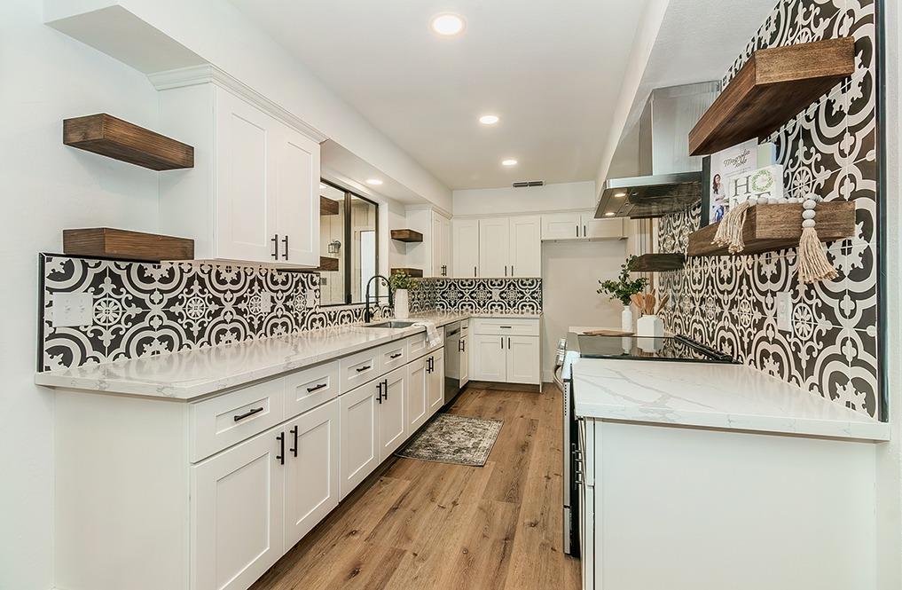 1824 Cougar Lane Clovis, CA 93611 - Photo 11 of 31 a kitchen with white cabinets and white appliances