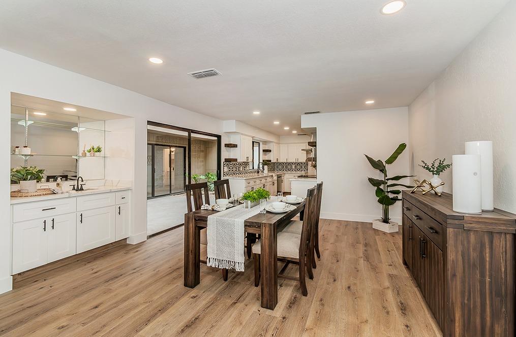 1824 Cougar Lane Clovis, CA 93611 - Photo 6 of 31 a view of a dining room with furniture and wooden floor