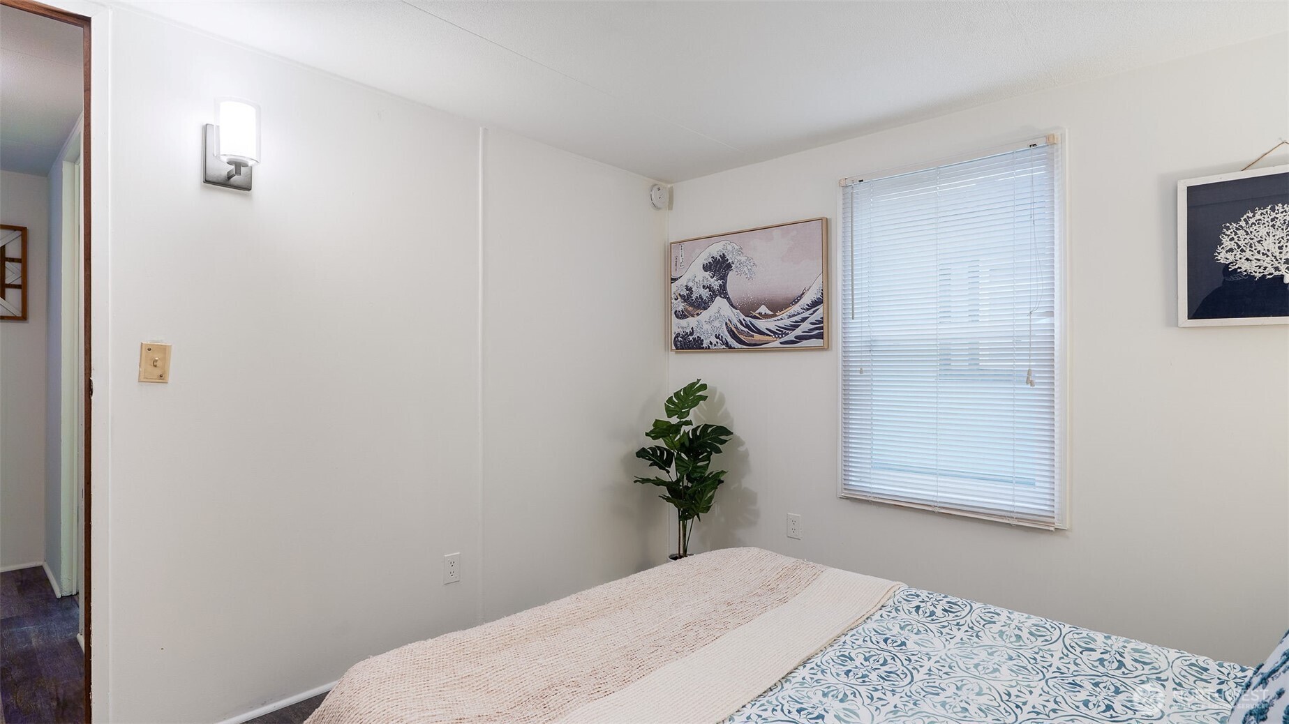 11622 Silver Lake Road, Unit 20B Everett, WA 98208 - Photo 14 of 38 a bedroom with a bed and a painting on the wall