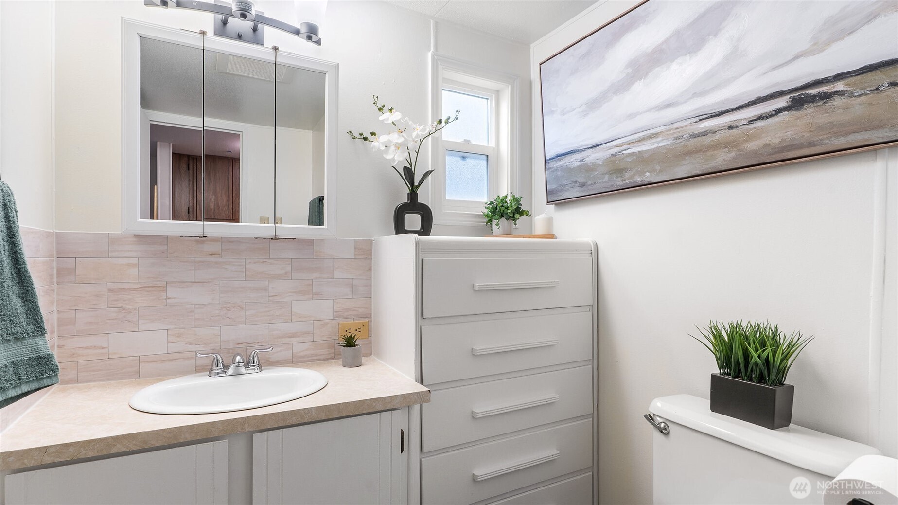 11622 Silver Lake Road, Unit 20B Everett, WA 98208 - Photo 16 of 38 a bathroom with a sink a toilet and a mirror
