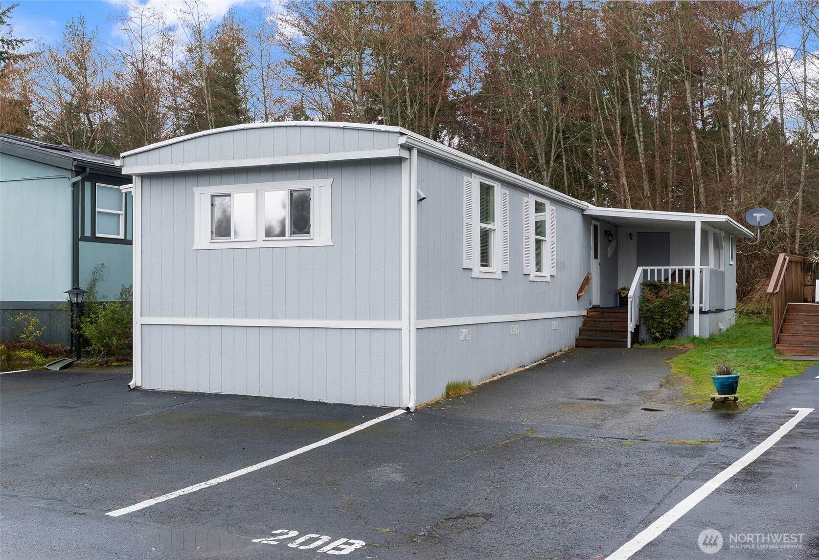 11622 Silver Lake Road, Unit 20B Everett, WA 98208 - Photo 24 of 38 a house with trees in the background