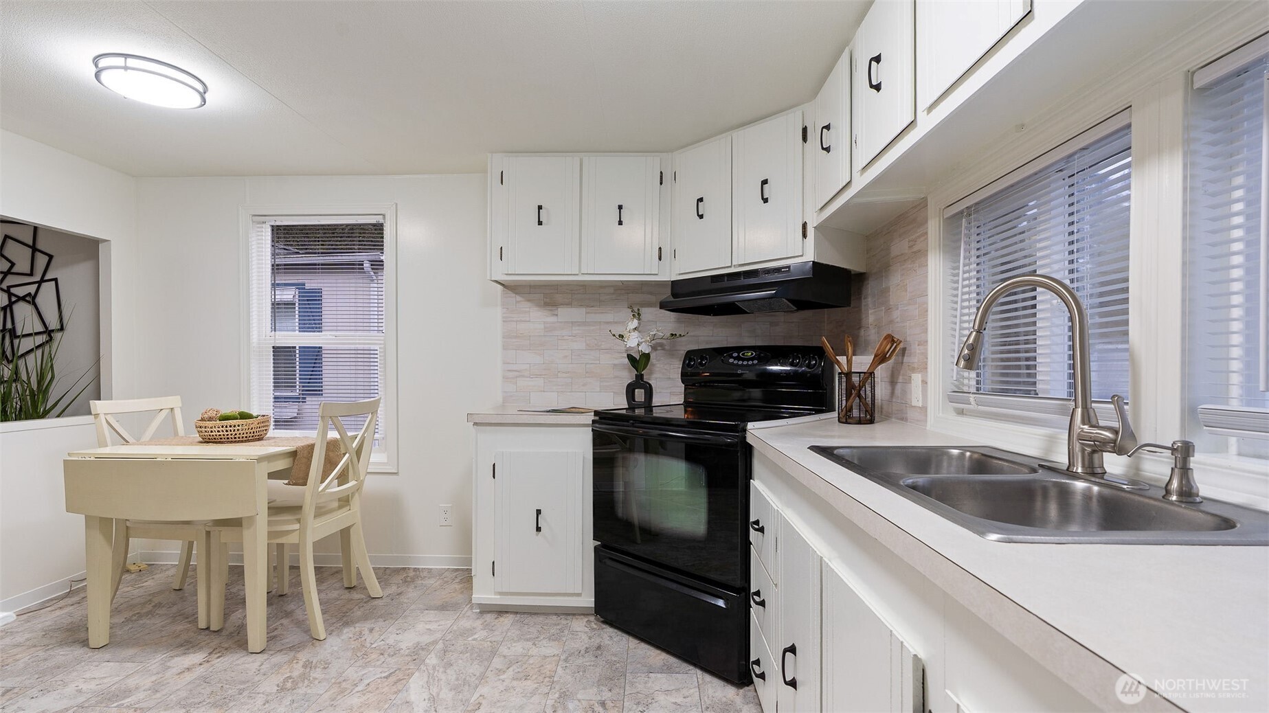 11622 Silver Lake Road, Unit 20B Everett, WA 98208 - Photo 9 of 38 a kitchen with granite countertop a sink stainless steel appliances and cabinets