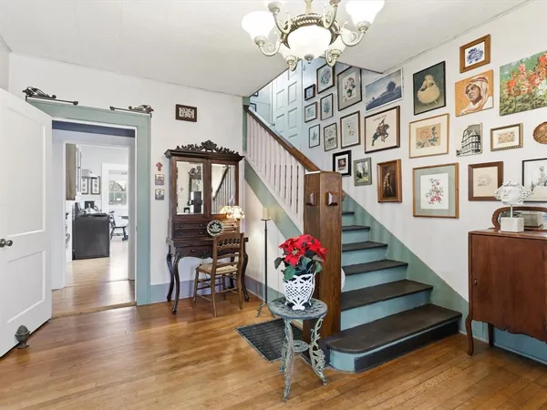 a view of entryway dining room and hall with wooden floor