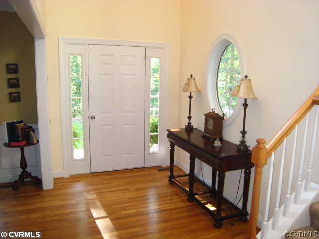 11511 Winterpock Road Chesterfield, VA 23838 - Photo 2 of 12 a view of an entryway with wooden floor and door