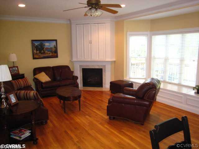 11511 Winterpock Road Chesterfield, VA 23838 - Photo 4 of 12 a living room with furniture fireplace and a large window