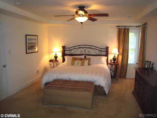 11511 Winterpock Road Chesterfield, VA 23838 - Photo 7 of 12 a bedroom with a bed and a chandelier