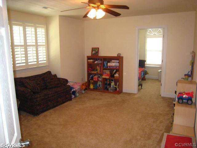 11511 Winterpock Road Chesterfield, VA 23838 - Photo 10 of 12 a living room with furniture and a chandelier