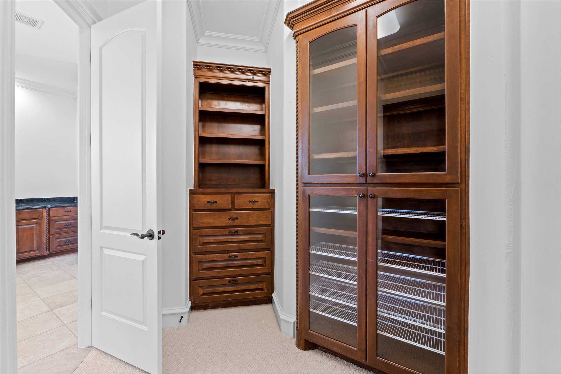 3401 Pearce Road Austin, TX 78730 - Photo 16 of 37 Owners closet with lots of cabinet storage