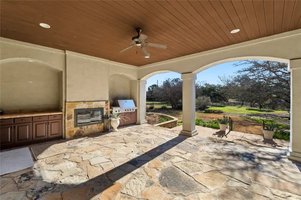 a view of a swimming pool with a patio