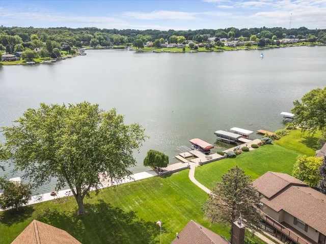 a view of yard with swimming pool and green space