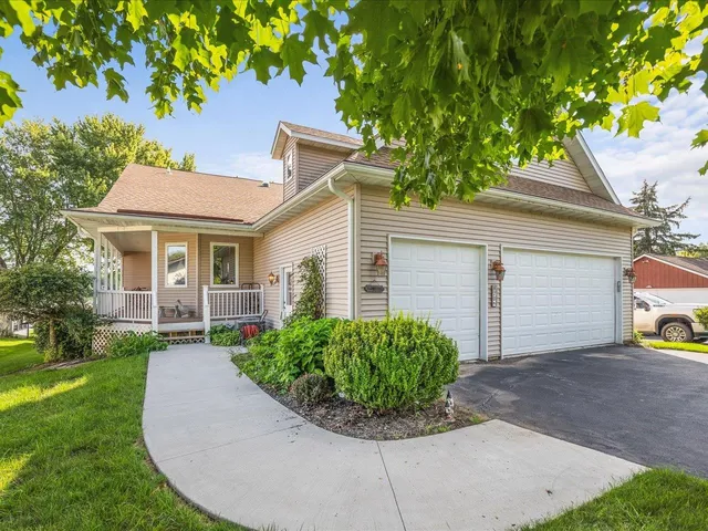 a kitchen with stainless steel appliances granite countertop a sink a stove and a wooden cabinets