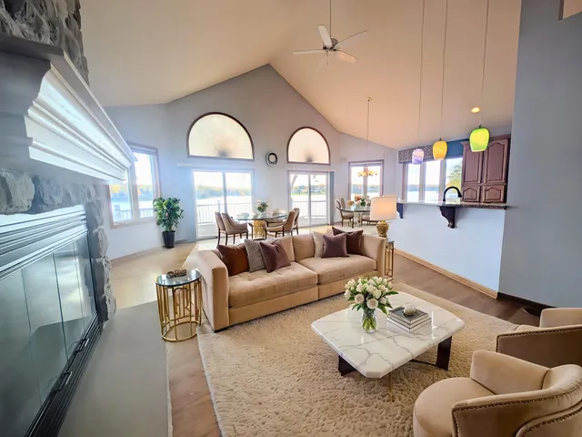 a view of a livingroom with workspace and a couch