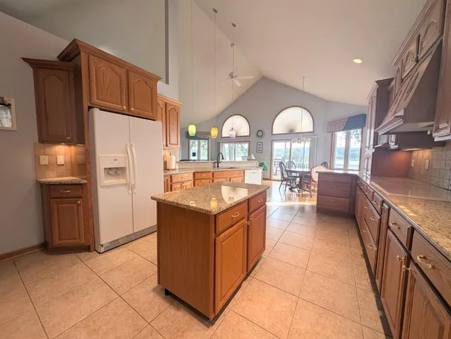 a view of a hallway and an dining rom with furniture