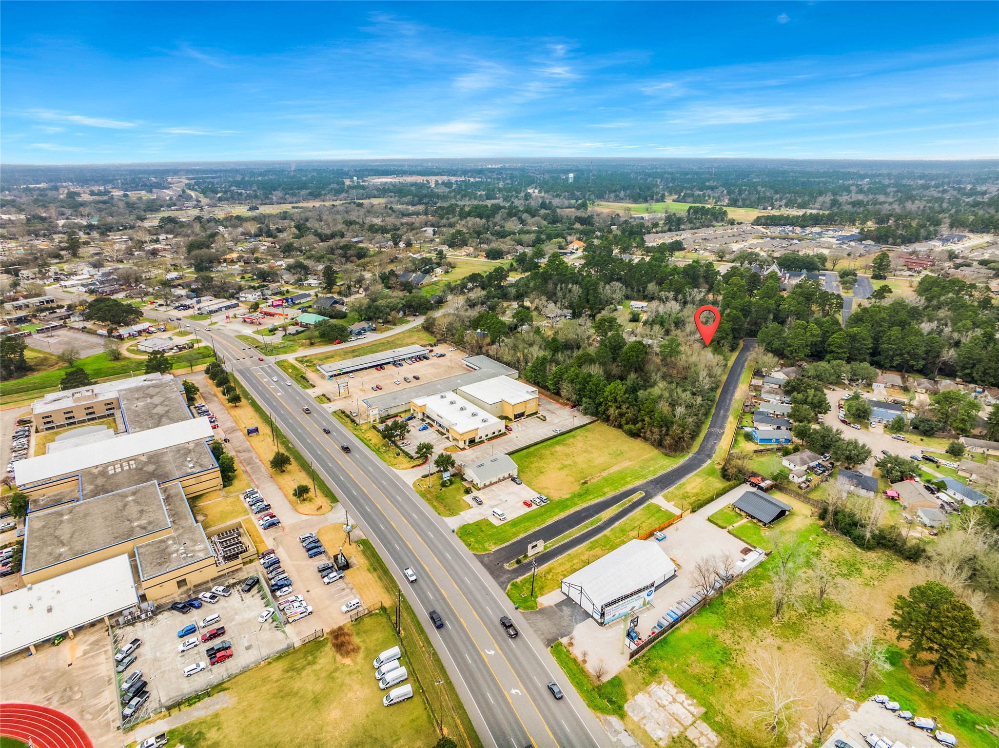 650 Texas Street Tomball, TX 77375 - Photo 11 of 22 an aerial view of a city