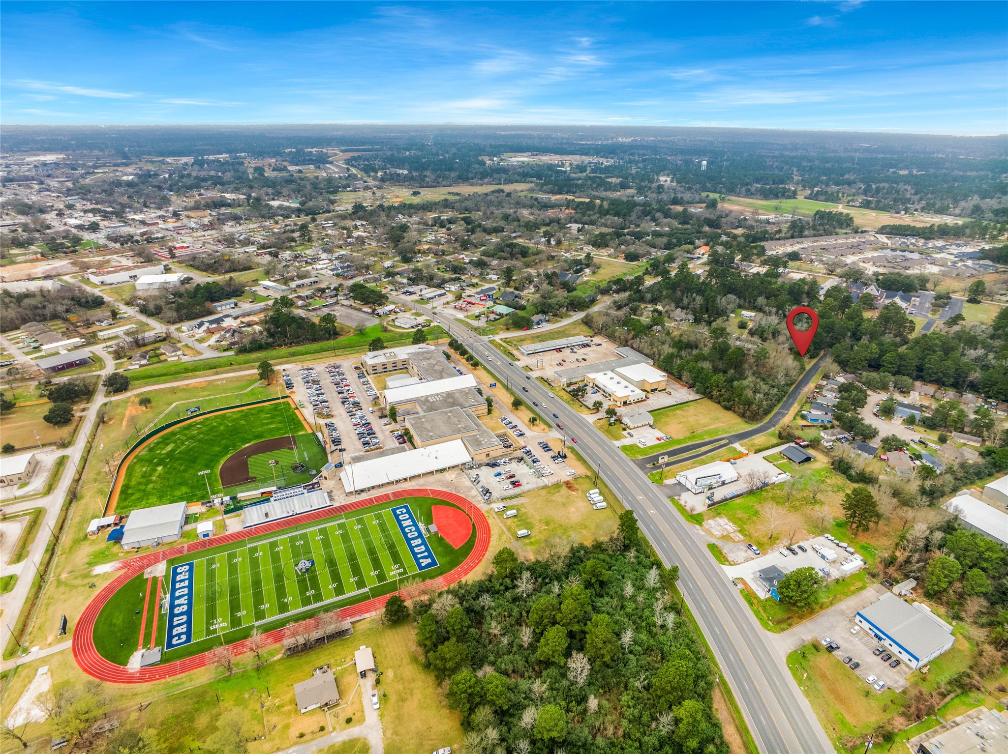 650 Texas Street Tomball, TX 77375 - Photo 19 of 22 an aerial view of a city