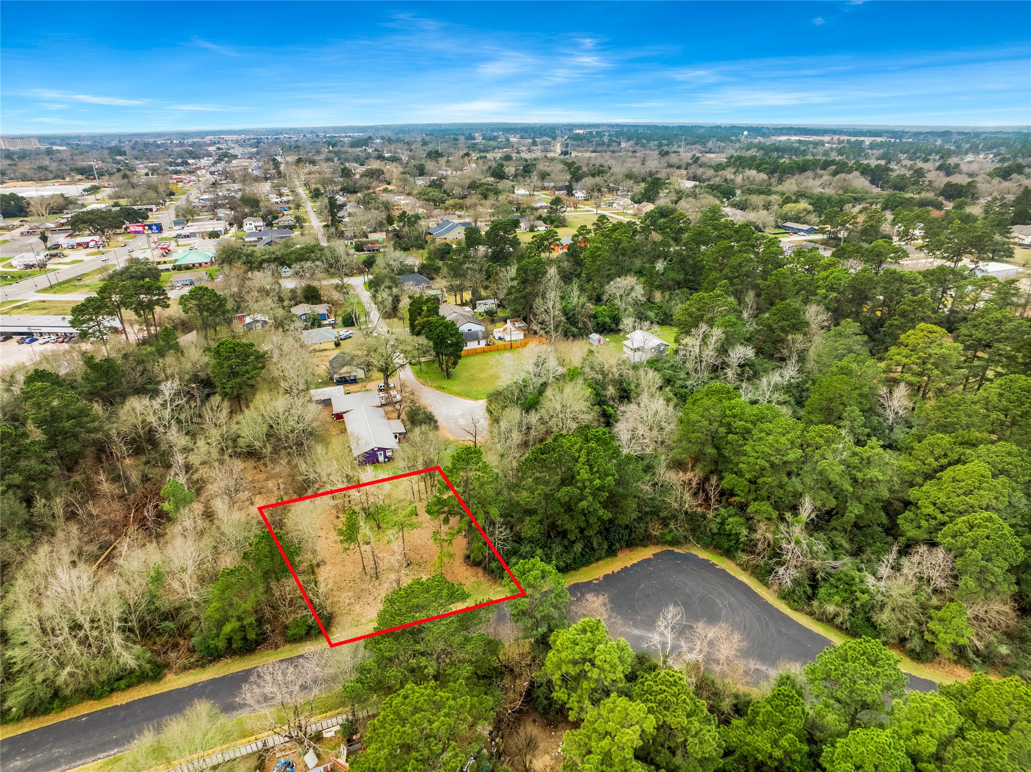 650 Texas Street Tomball, TX 77375 - Photo 21 of 22 an aerial view of residential houses with outdoor space and trees