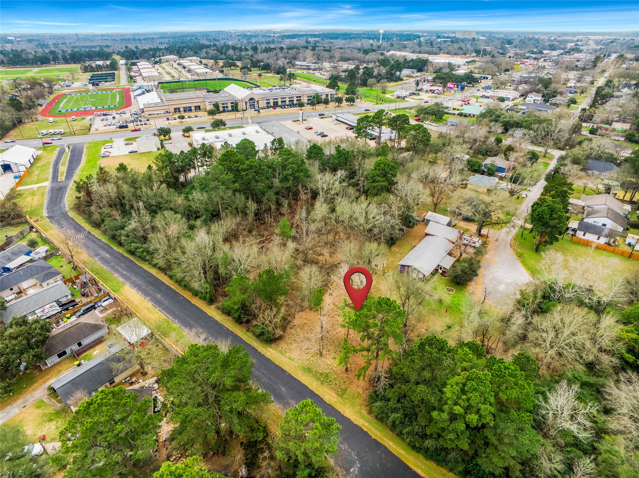 650 Texas Street Tomball, TX 77375 - Photo 7 of 22 an aerial view of residential houses with outdoor space and seating