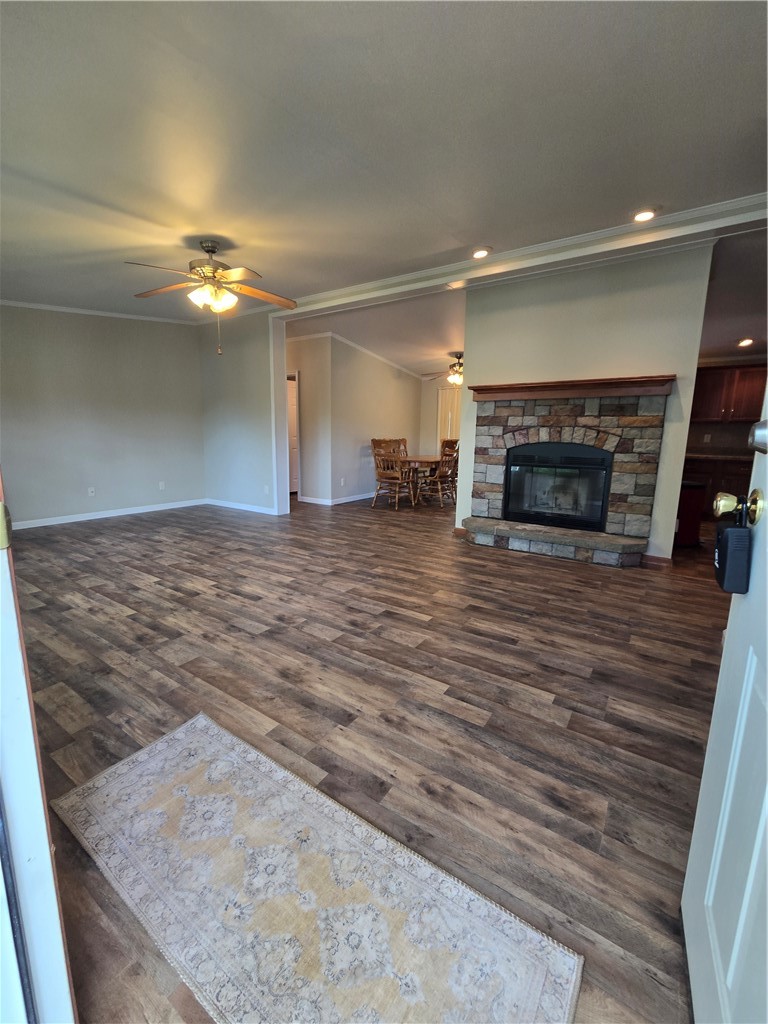 5337 State Rte 26 Triangle, NY 13862 - Photo 2 of 22 Rich wood-textured flooring flows past a stone fireplace in this open living area.