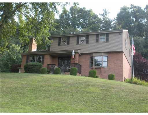 1155 O'Block Road Plum, PA 15239 - Photo 1 of 18 Exterior Front. BRICK AND VINYL TWO STORY HOME ON APPROX 3.236 ACRES WITH 2CAR SIDE ENTRY GARAGE AND COVERED FRONT PORCH.
