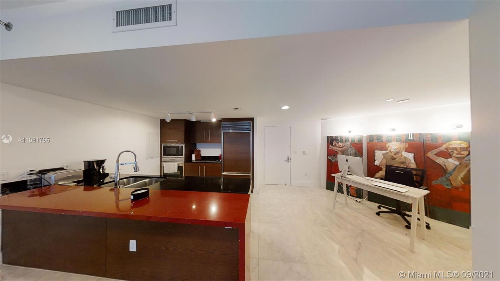 475 Brickell Avenue, Unit 1909 Miami, FL 33131 - Photo 3 of 12 a view of a room with gym equipment