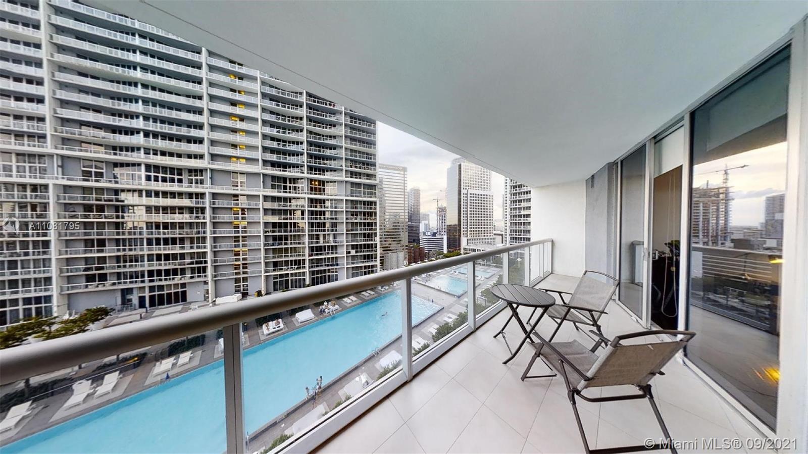 475 Brickell Avenue, Unit 1909 Miami, FL 33131 - Photo 9 of 12 a view of a balcony with chairs