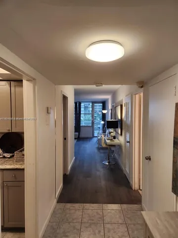 a view of livingroom with furniture and floor to ceiling window
