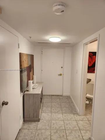 a view of room with furniture and wooden floor