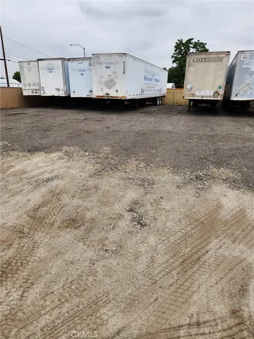 a view of a street with a building in the background