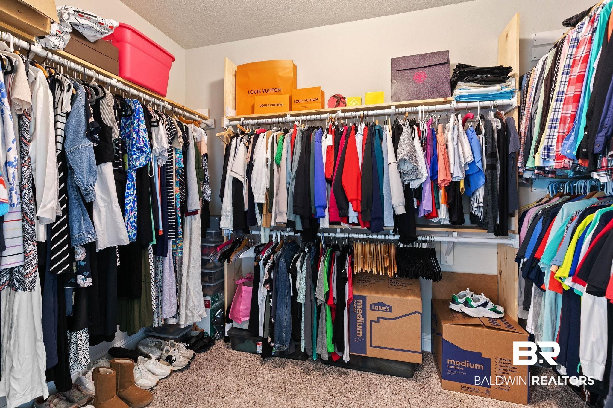 12750 B Jenkins Pit Road Daphne, AL 36527 - Photo 40 of 89 Walk in closet featuring light colored carpet