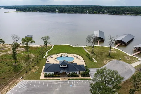 an aerial view of a house with a lake view