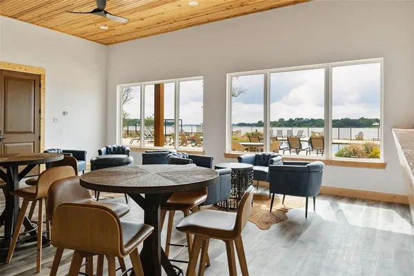 a view of a dining room with furniture and window