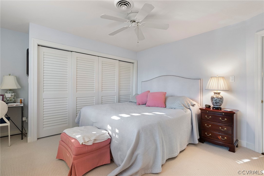 6161 River Road, Unit 27 Richmond, VA 23226 - Photo 17 of 26 a bedroom with a bed and a chandelier