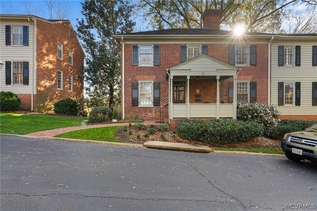 6161 River Road, Unit 27 Richmond, VA 23226 - Photo 25 of 26 a front view of a house with a yard and garage