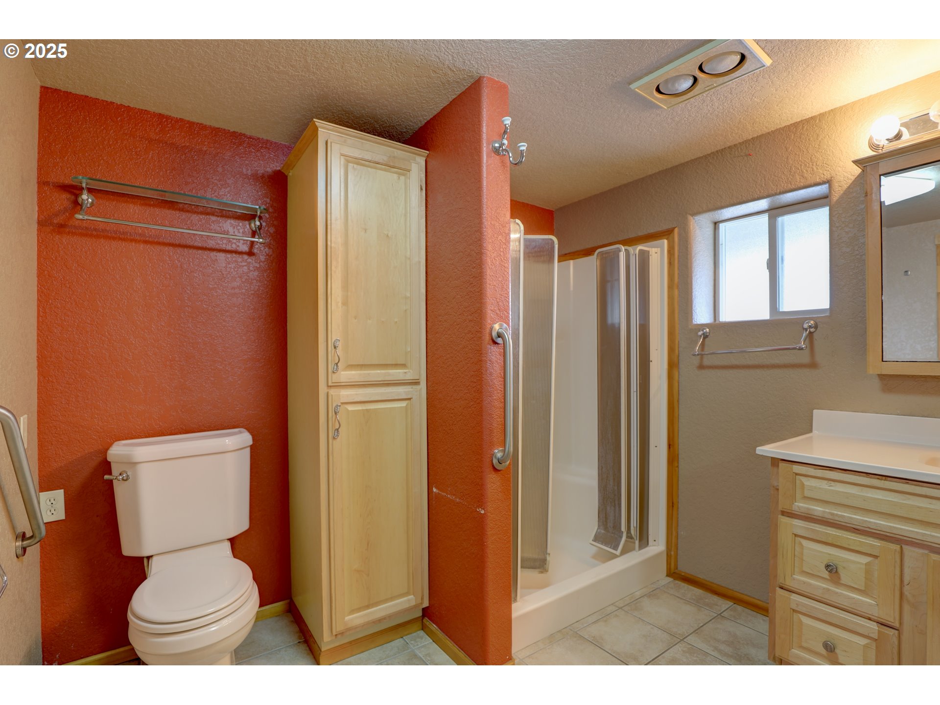 1520 Dallesport Road Dallesport, WA 98617 - Photo 11 of 48 a bathroom with a toilet sink a shower and a window