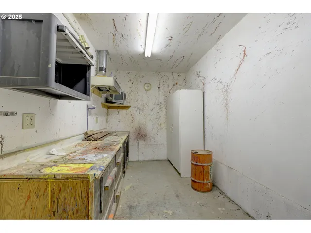 a bathroom with a sink a toilet and dryer