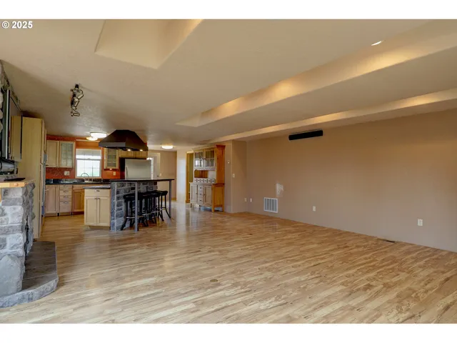 a view of a room with lots of wooden furniture