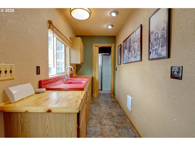a dining room with a table and chairs