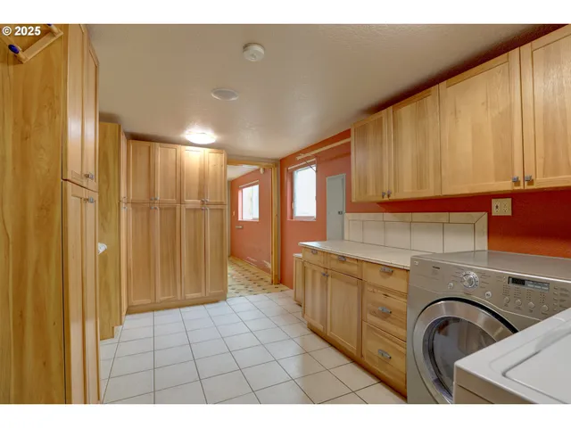 a bathroom with a sink a mirror and a shower