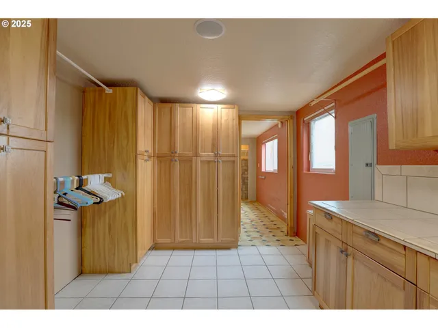 a bathroom with a shower and a sink