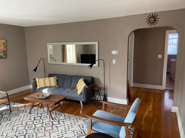 a outdoor living space with furniture and rug