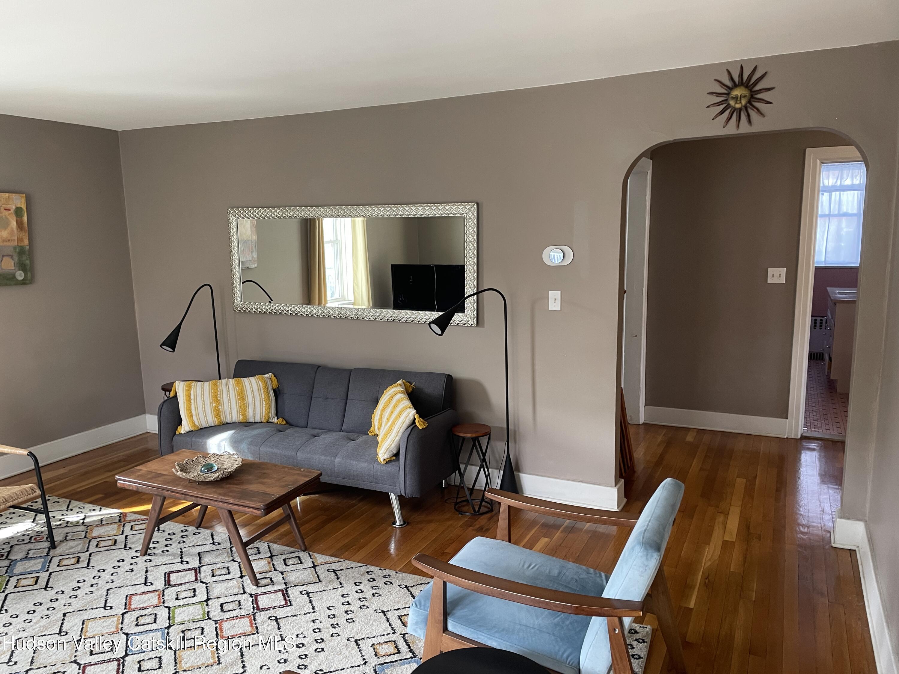 a outdoor living space with furniture and rug