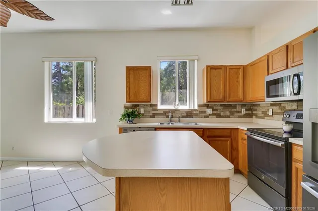 a view of a kitchen with microwave and cabinets