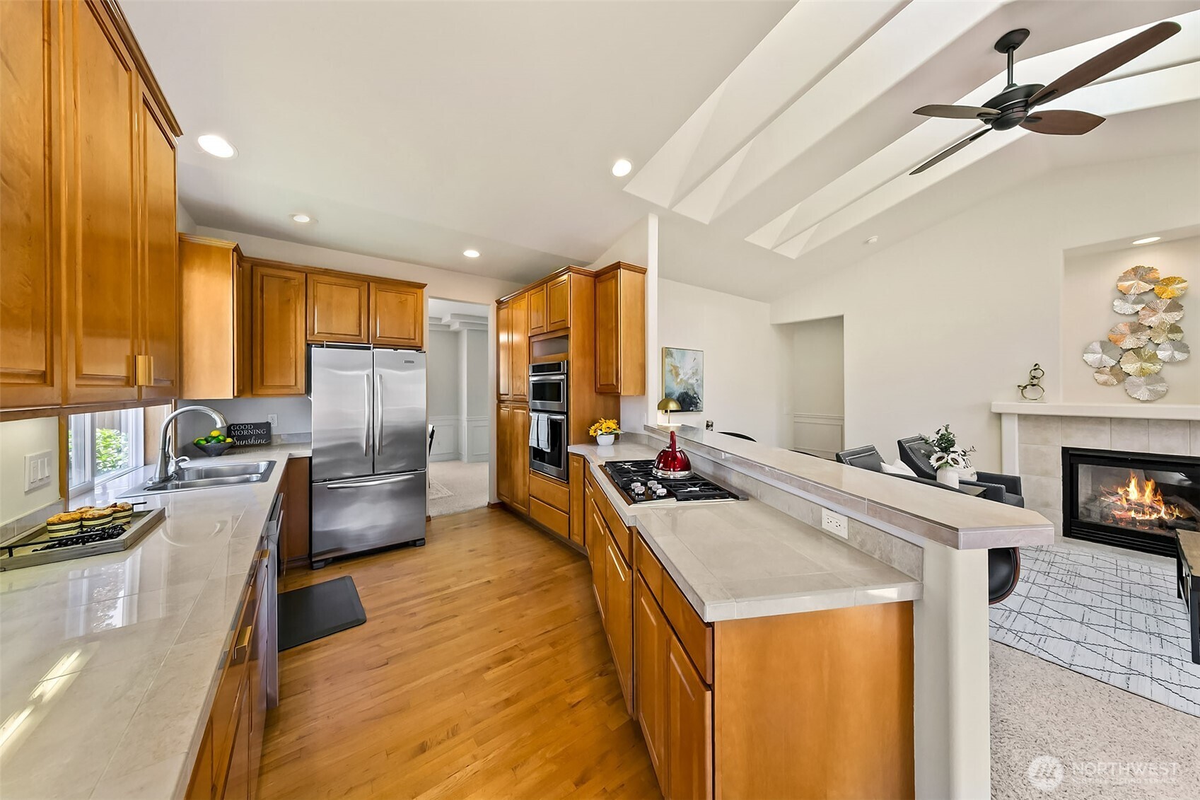 20604 Damson Road Lynnwood, WA 98036 - Photo 8 of 24 a kitchen with stainless steel appliances granite countertop a sink stove and refrigerator