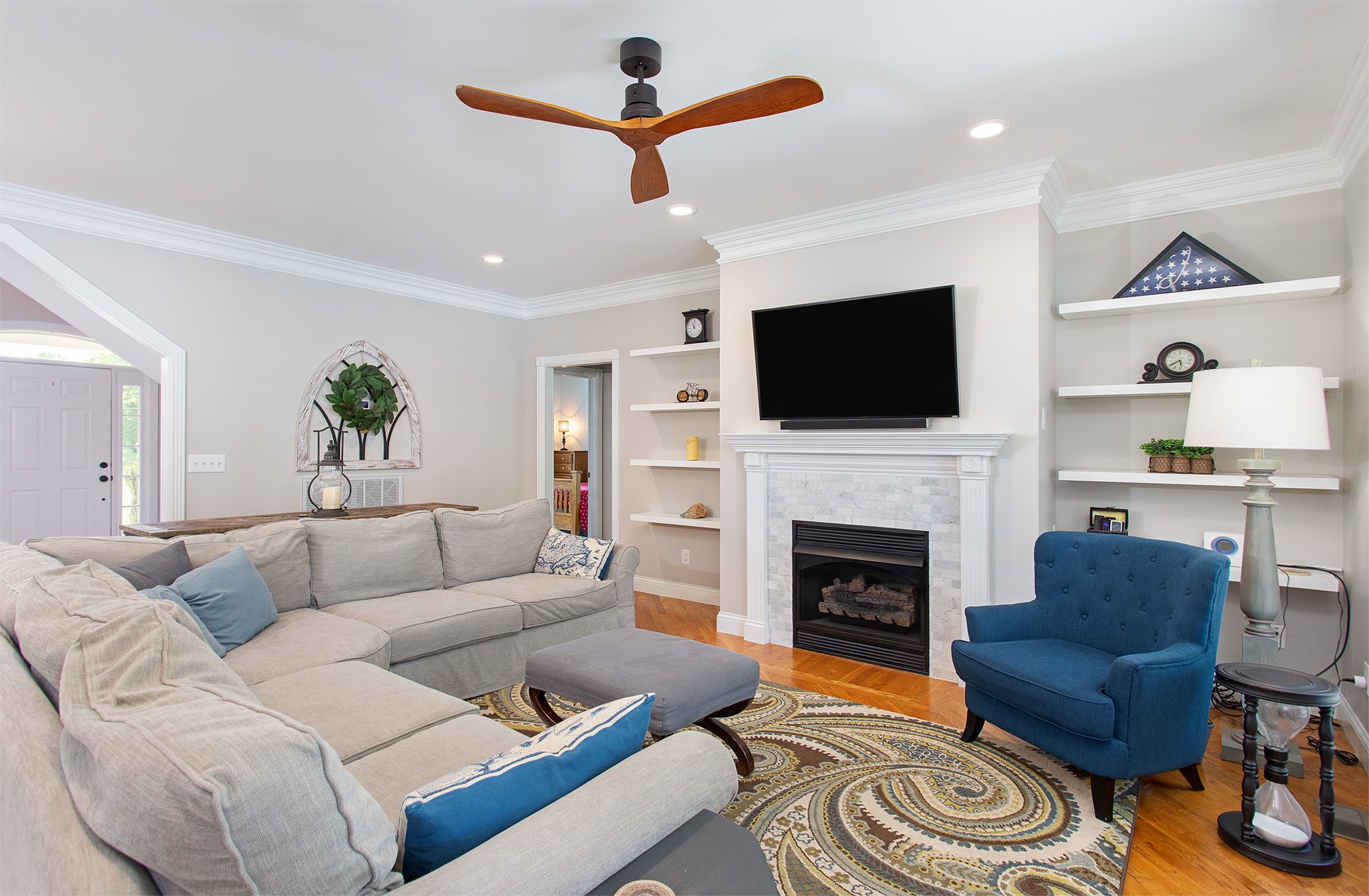 182 West Harper Road Portland, TN 37148 - Photo 13 of 29 a living room with furniture a flat screen tv and a fireplace