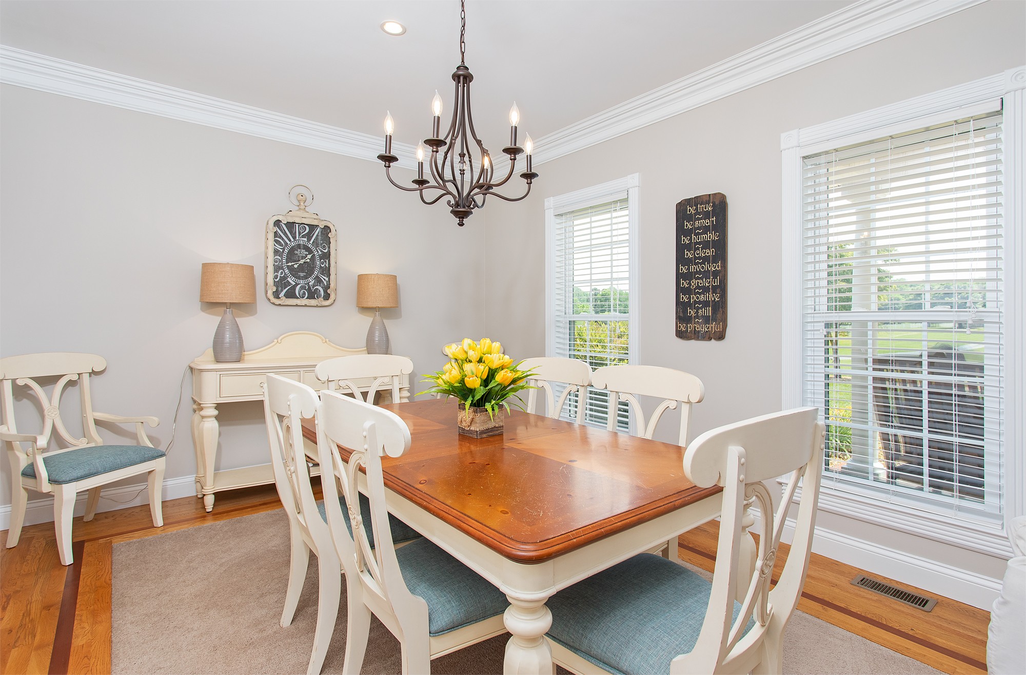 182 West Harper Road Portland, TN 37148 - Photo 14 of 29 a view of a dining room with furniture a chandelier and wooden floor