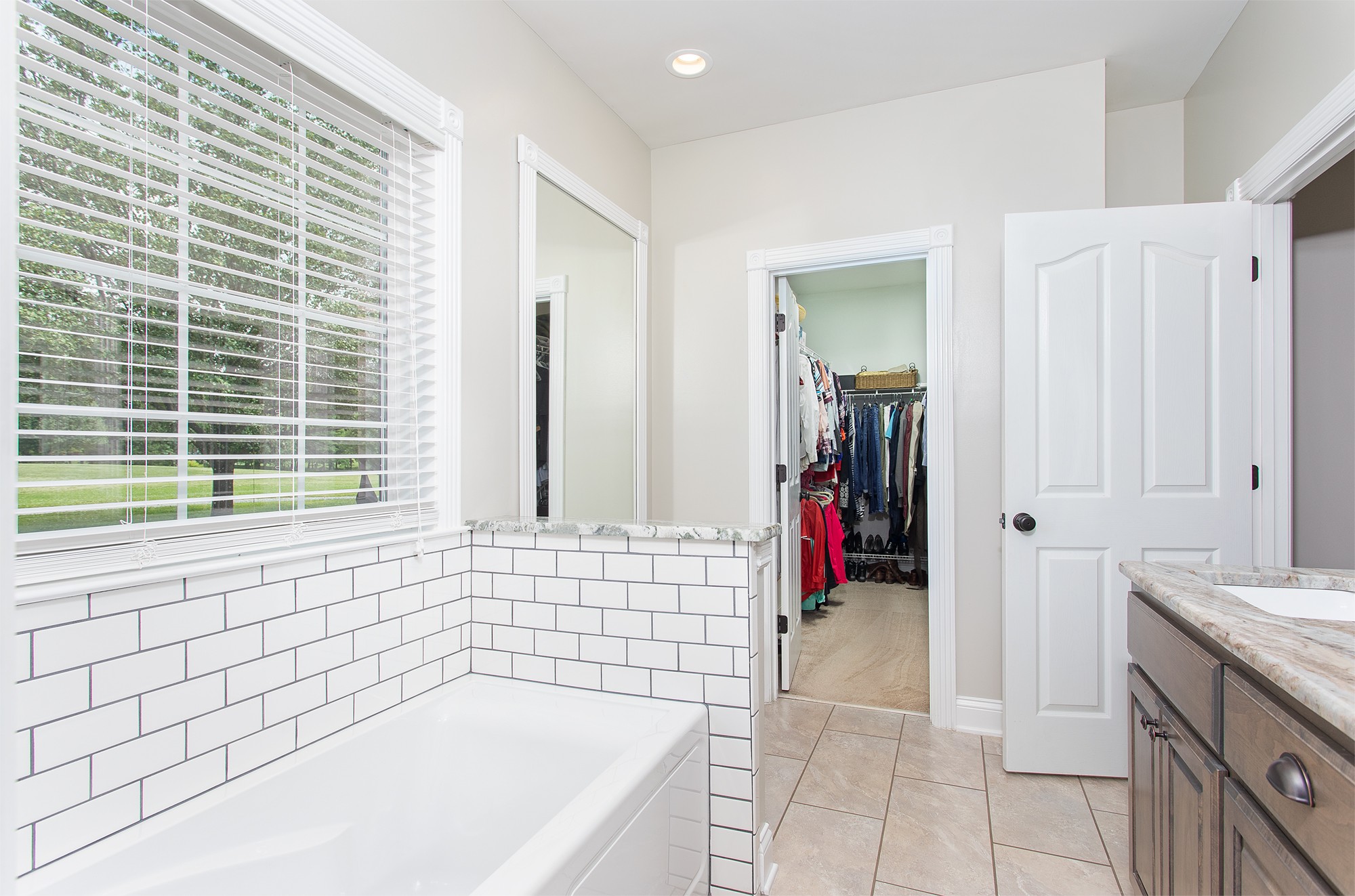 182 West Harper Road Portland, TN 37148 - Photo 17 of 29 a bathroom with a tub sink and a mirror