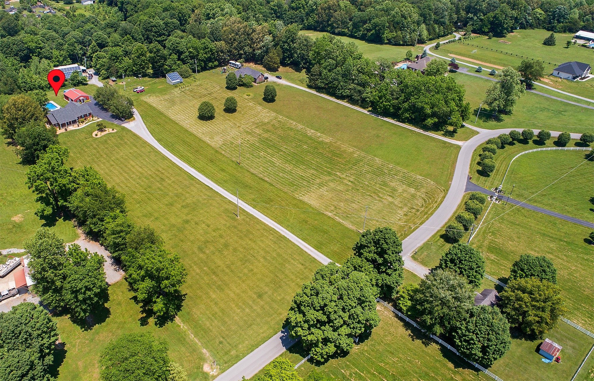 182 West Harper Road Portland, TN 37148 - Photo 29 of 29 an aerial view of a house with swimming pool and green space