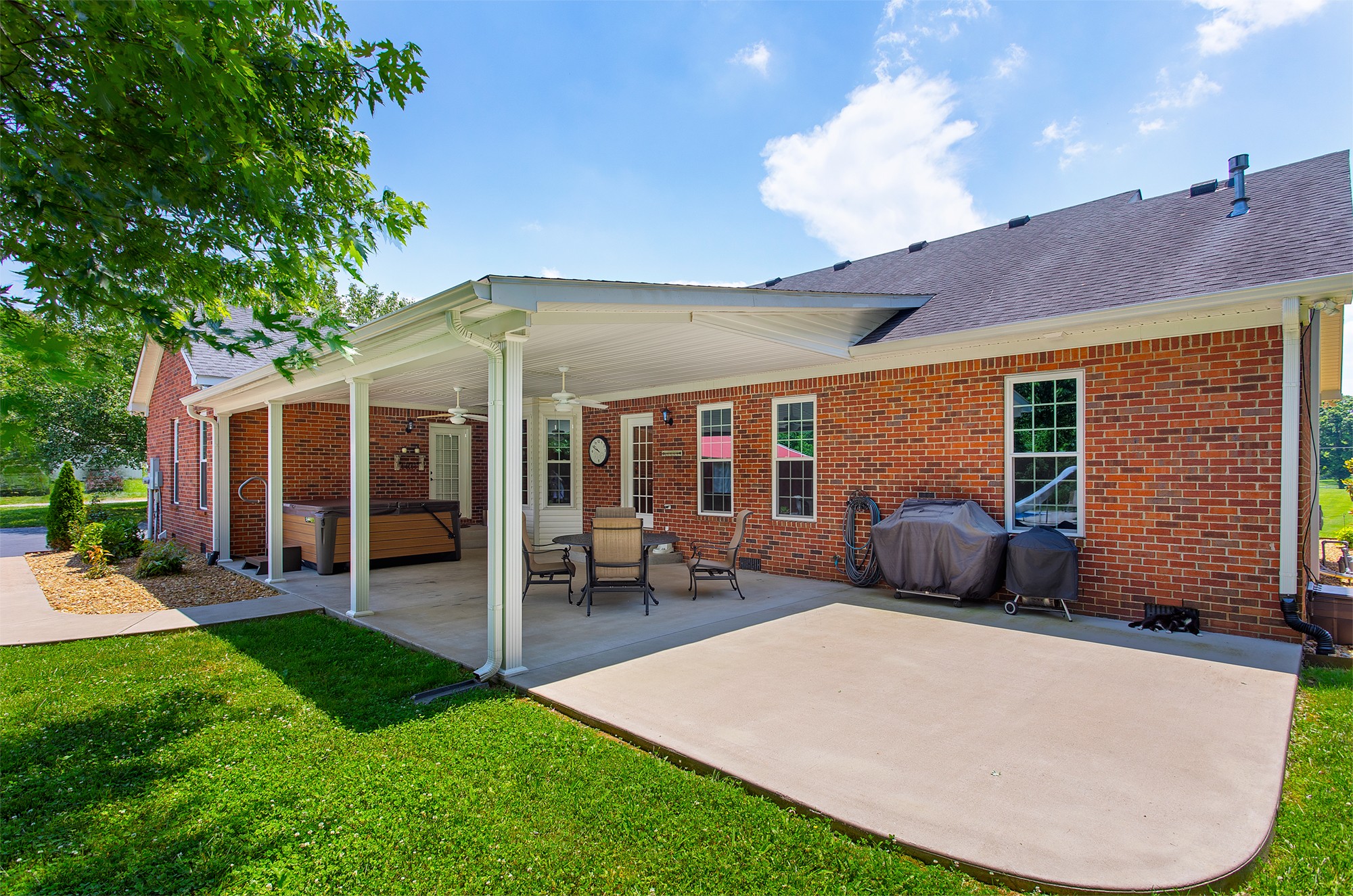 182 West Harper Road Portland, TN 37148 - Photo 4 of 29 a view of a house with backyard porch and sitting area