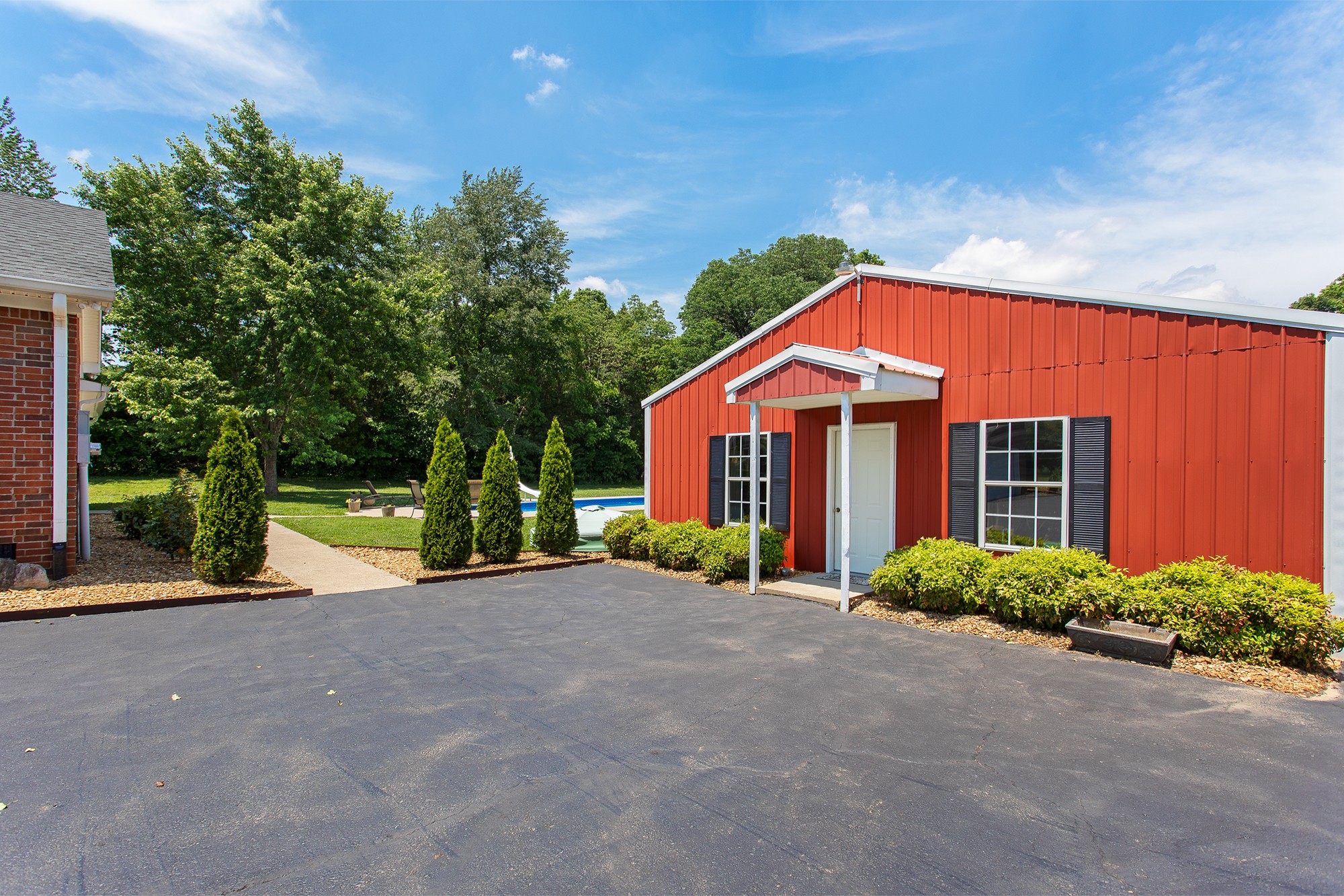 182 West Harper Road Portland, TN 37148 - Photo 7 of 29 a view of a house with a yard and potted plants